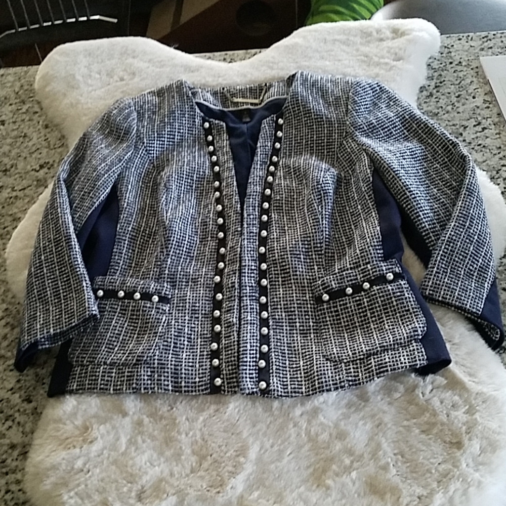 Pearl embellishments on navy tweed jacket